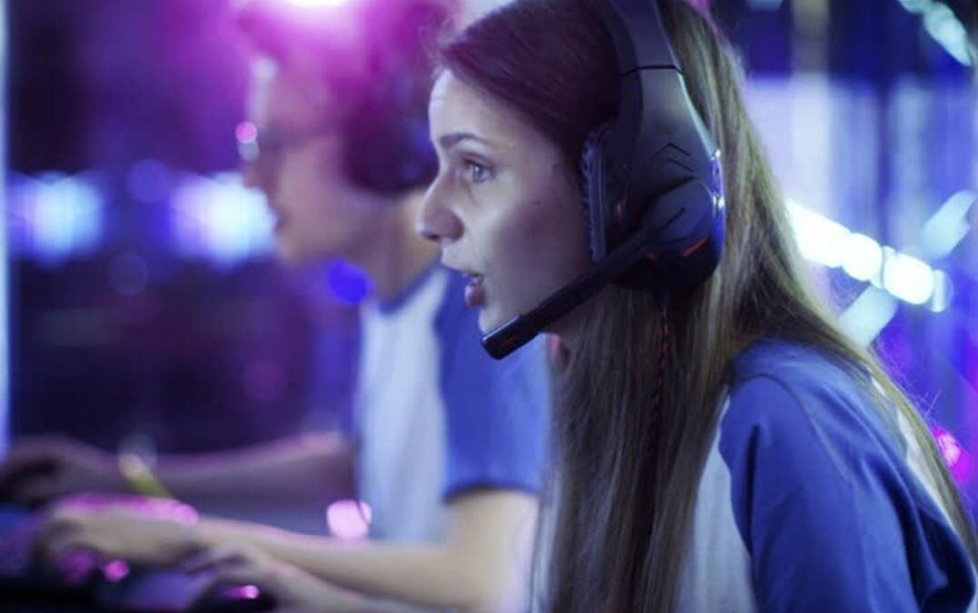 A focused gamer at a professional setup, illustrating skill development